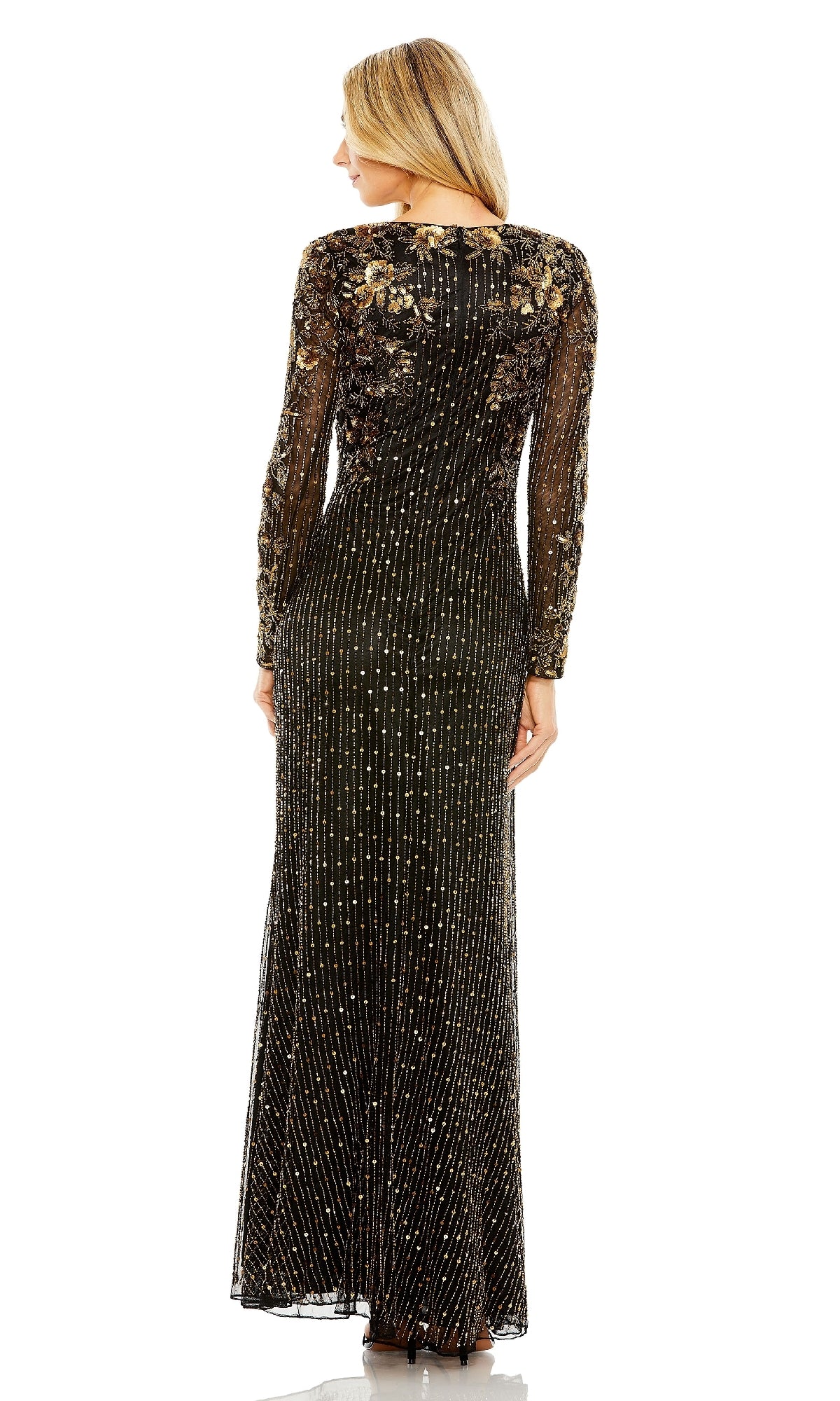 A woman faces away, wearing the Mac Duggal 5956 Gold-Beaded Black Formal Gown with sheer long sleeves, gold embellishments, and intricate beadwork throughout.
